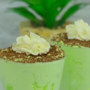 2 tumbler glasses with low carb shamrock shake mousse.