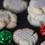 shortbread cookies on parchment paper with christmas decorations.
