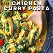 thai chicken curry pasta in a skillet.