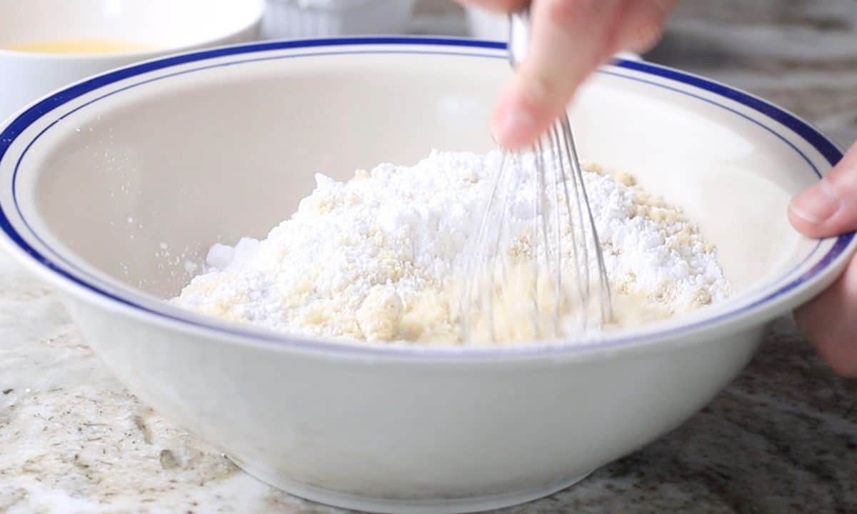 whisking the dry ingredients in a large bowl.