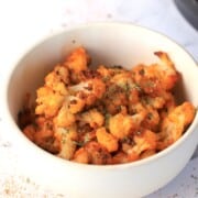 Roasted cauliflower in a white bowl.