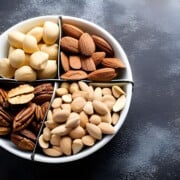 photo of mixed nuts in a white dish.