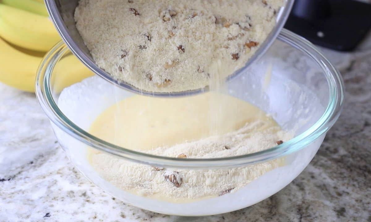 transferring the dry ingredients into the wet ingredients bowl.