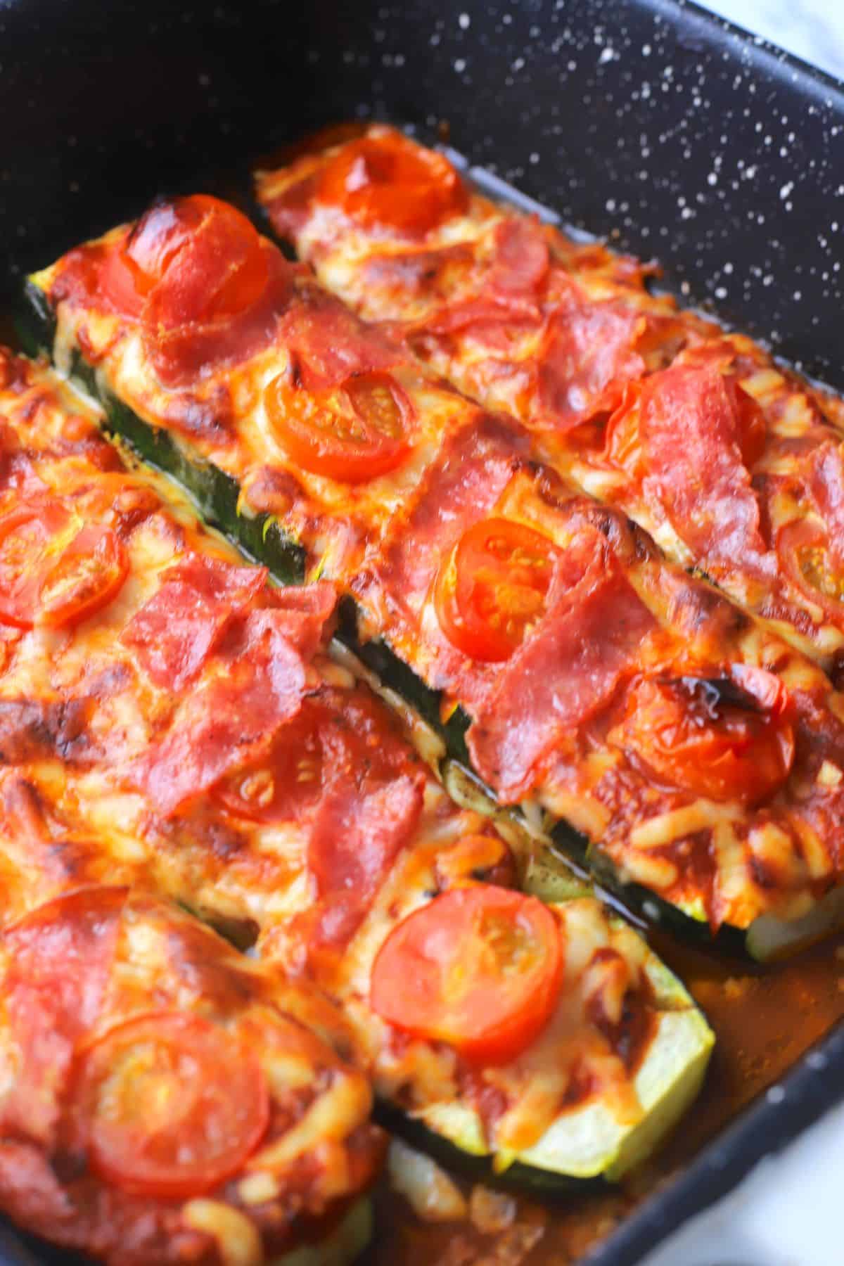 Zucchini Pizza Boats in the roasting pan.