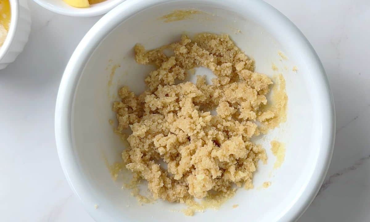 Crumble mixture in a white bowl.