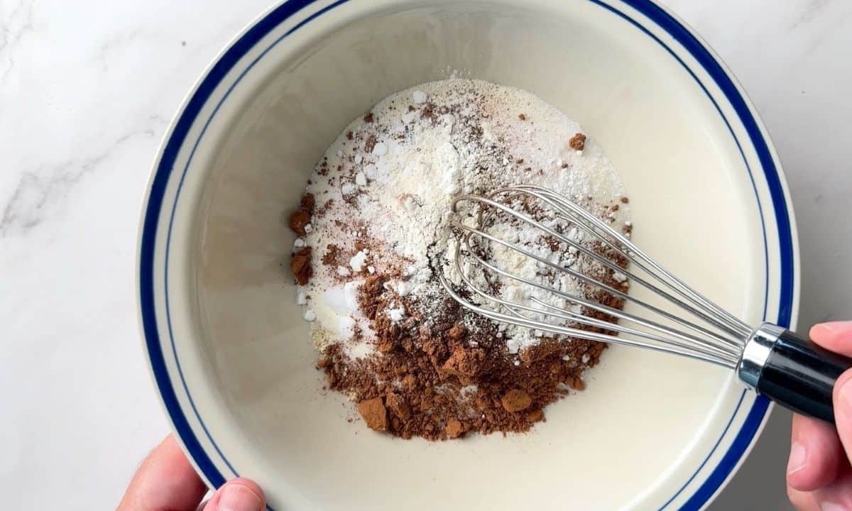 Mixing the dry ingredients in a large bowl with a whisk.