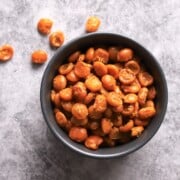 Low carb roasted lupini beans in a black bowl.