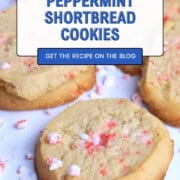Sugar free peppermint shortbread cookies topped with crushed candy canes on a white plate.