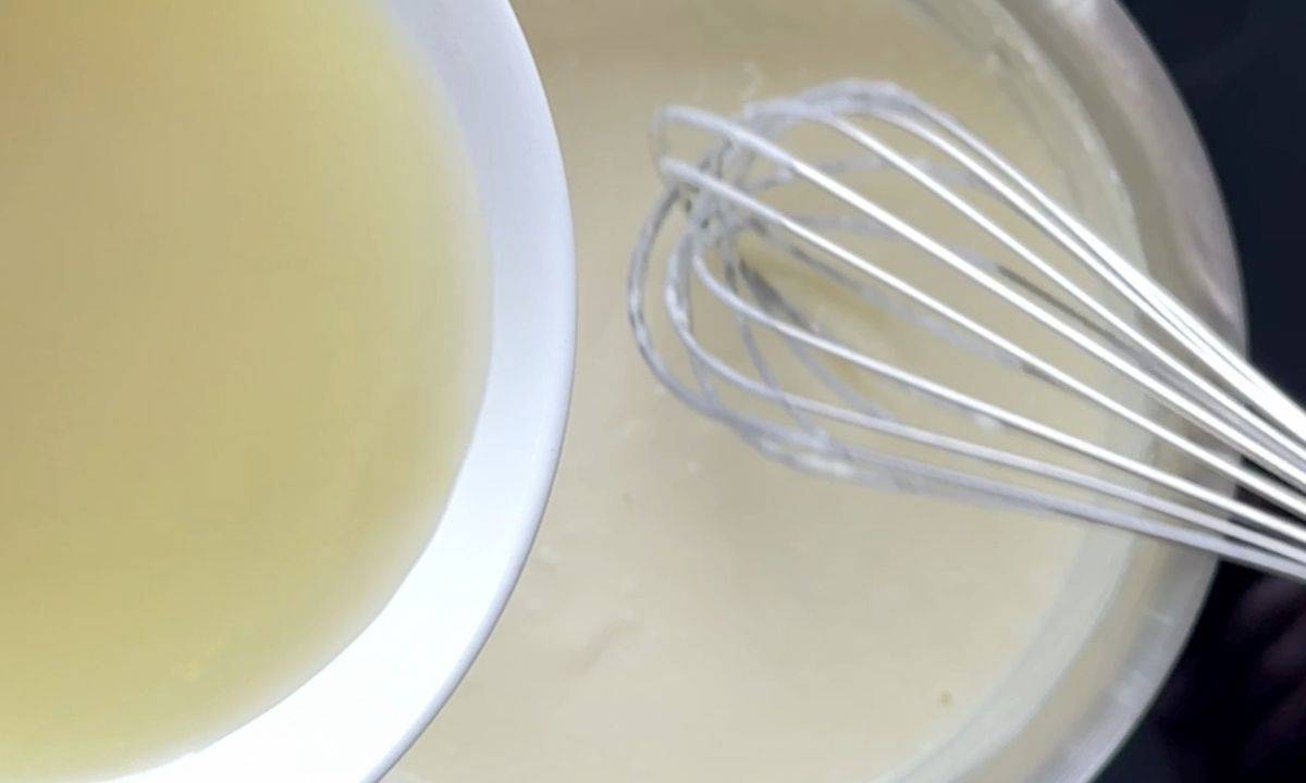 Whisking in the chicken broth.