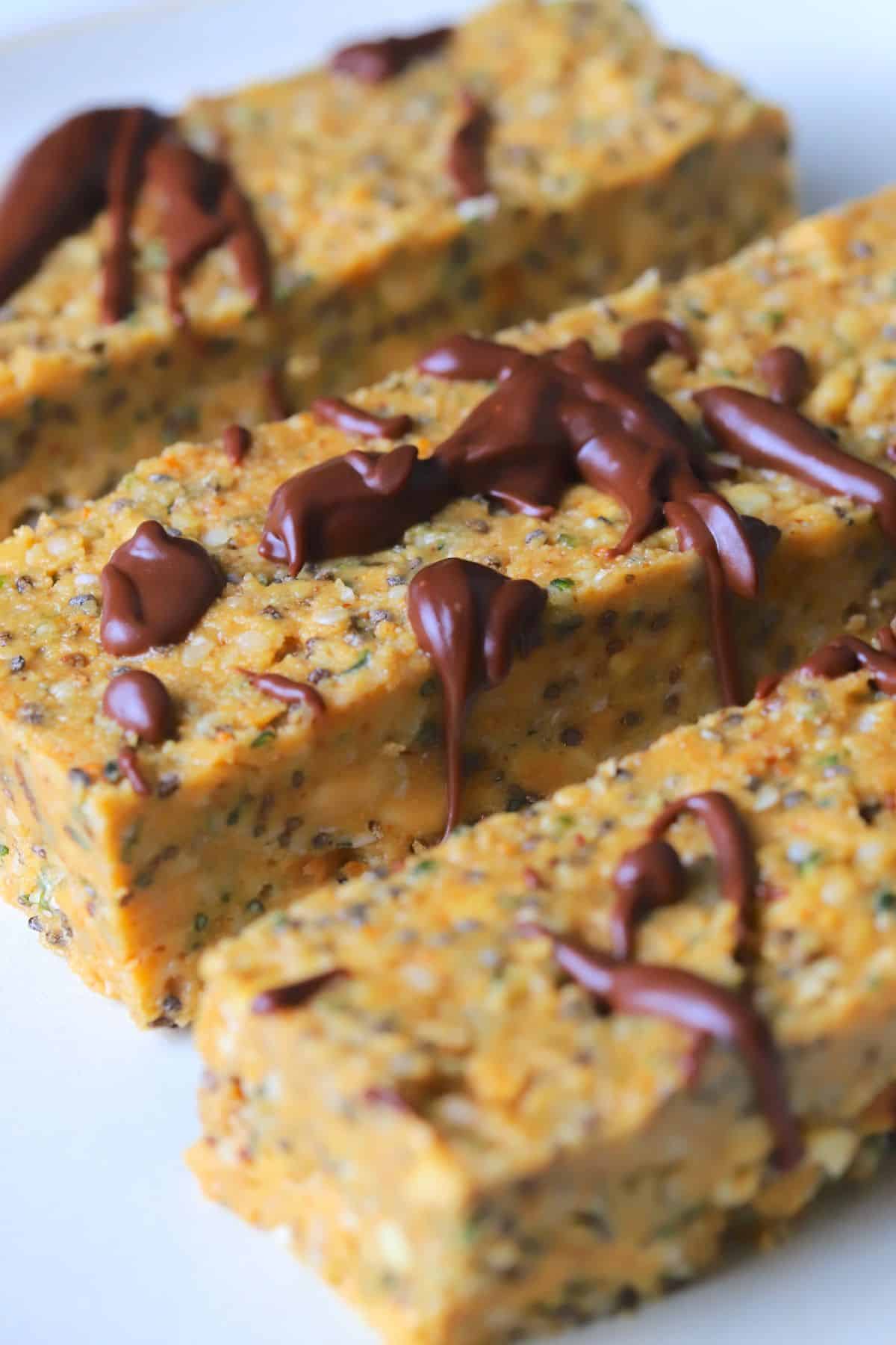 Gluten and dairy free protein bars drizzled with chocolate.