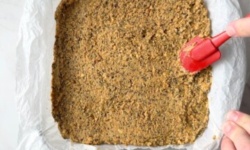 Spreading the mixture into the baking dish.