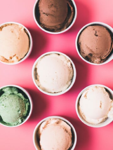 Multiple bowl of ice cream with a pink background.