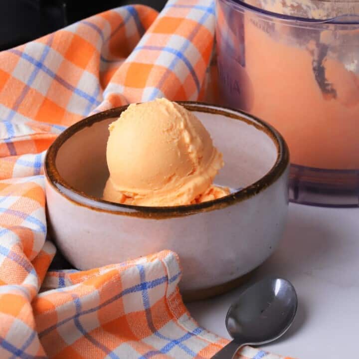 A bowl of sugar free orange creamsicle ice cream.