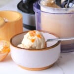 Sugar free salted caramel ice cream in a bowl next to the creami pint.