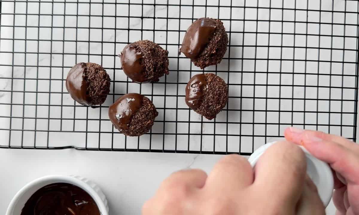 Sprinkling sea salt on to the top of the collagen cookies.