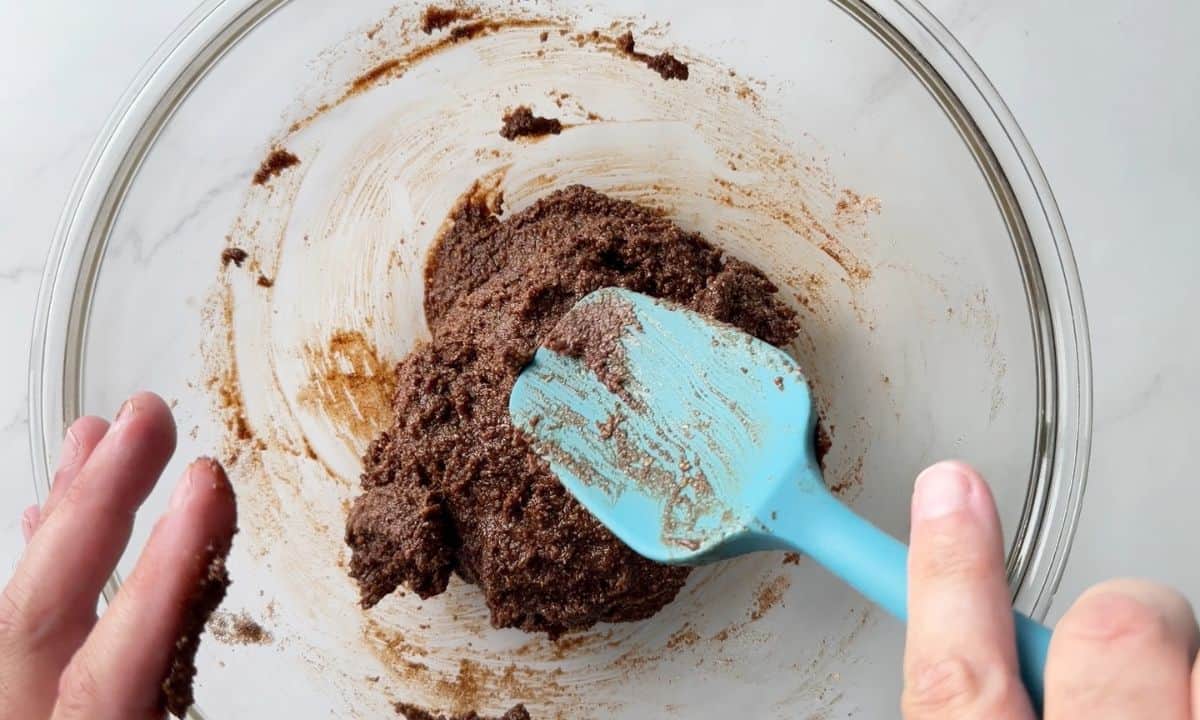 Mixing the wet ingredients in a large glass bowl.