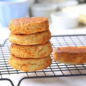 Four air fryer scones stacked on a cooling rack.