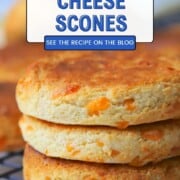 Three air fryer scones stacked on a cooling rack.