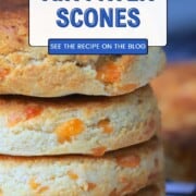 Four air fryer scones stacked on a cooling rack.