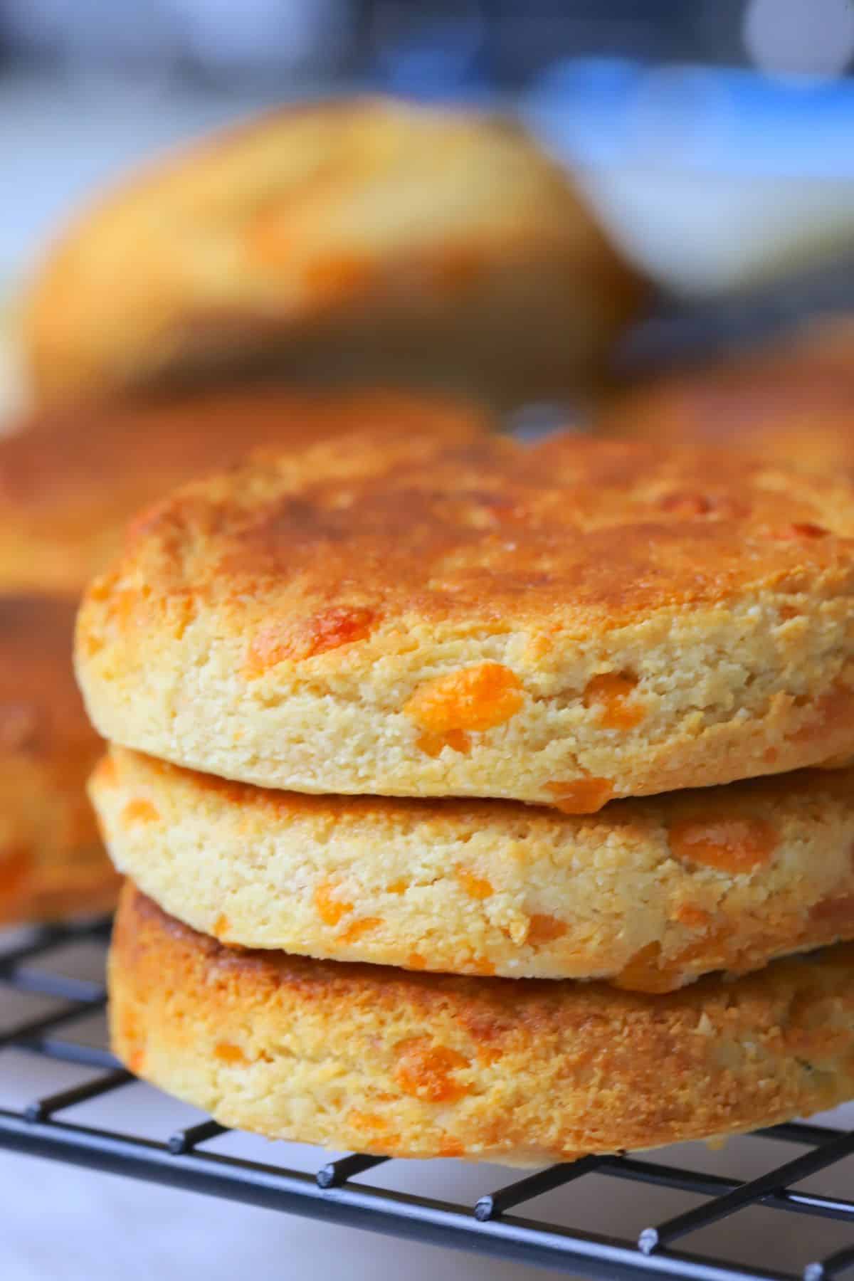 Three air fryer scones stacked on a cooling rack.