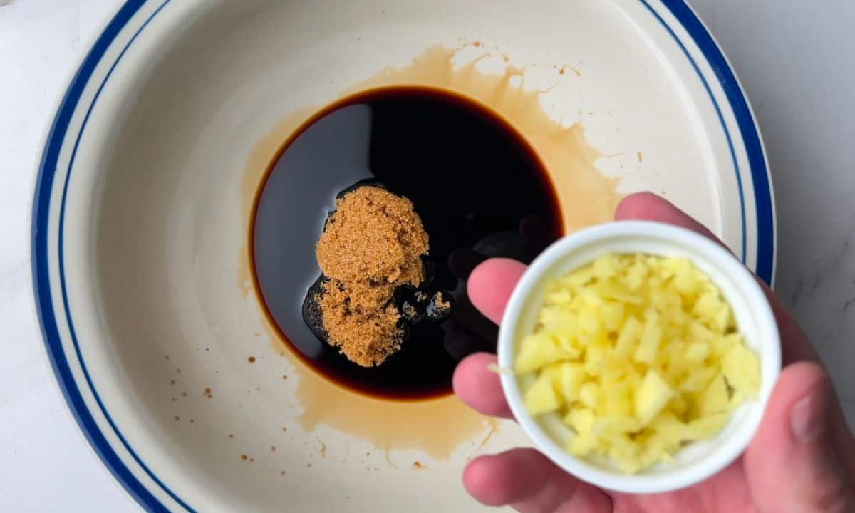 Adding the sauce ingredients to a bowl.