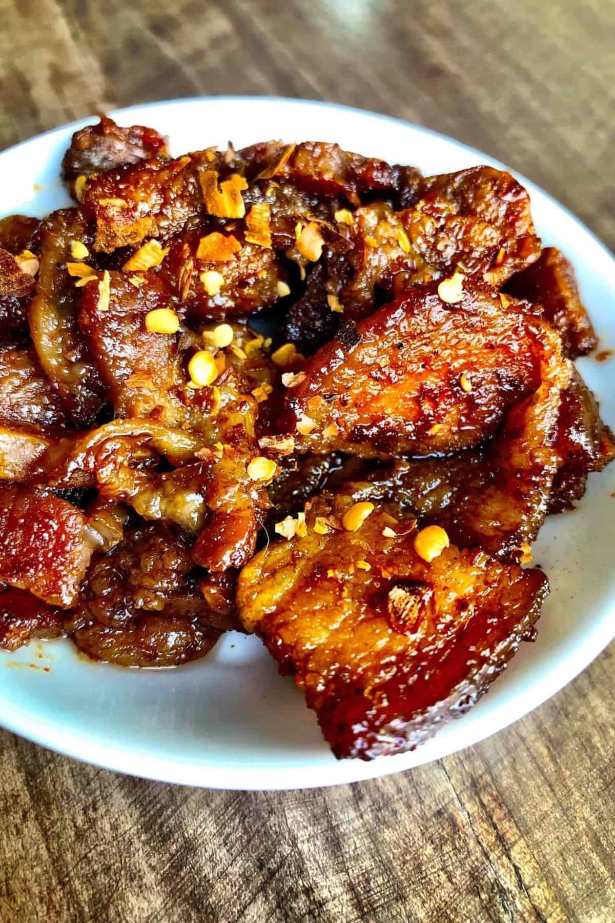 Sweet and spicy keto pork belly in a bowl.