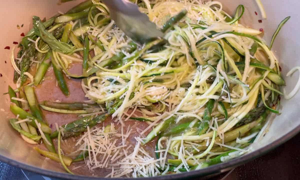 adding the parmesan to the asparagus with garlic, lemon rind and chili pepper flakes.
