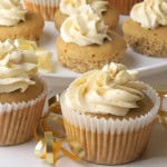 Low carb eggnog cupcakes on a white background with a gold ribbon.