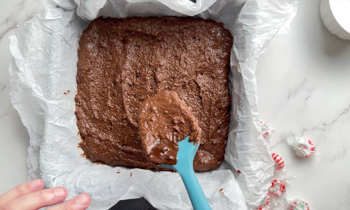 Smoothing out the batter in the cake pan.