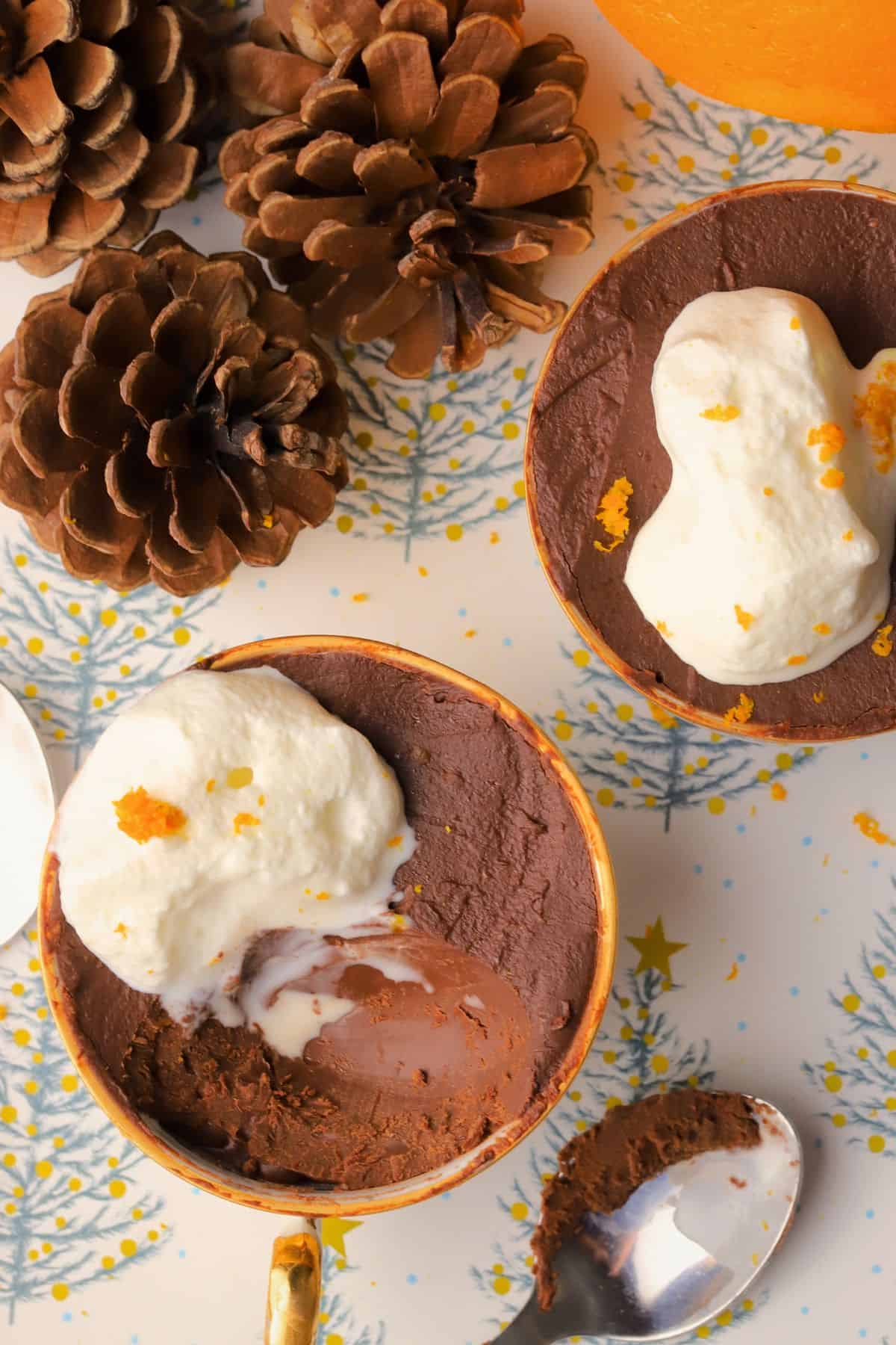 Sugar Free Orange chocolate pots in teacups next to acorns, and orange and a spoon.