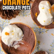 Sugar Free Orange chocolate pots in teacups next to acorns, and orange and a spoon.