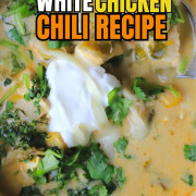 Overhead shot of a bowl with chicken chili topped with sour cream and cilantro.