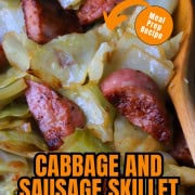 Cabbage and sausage in a skillet.