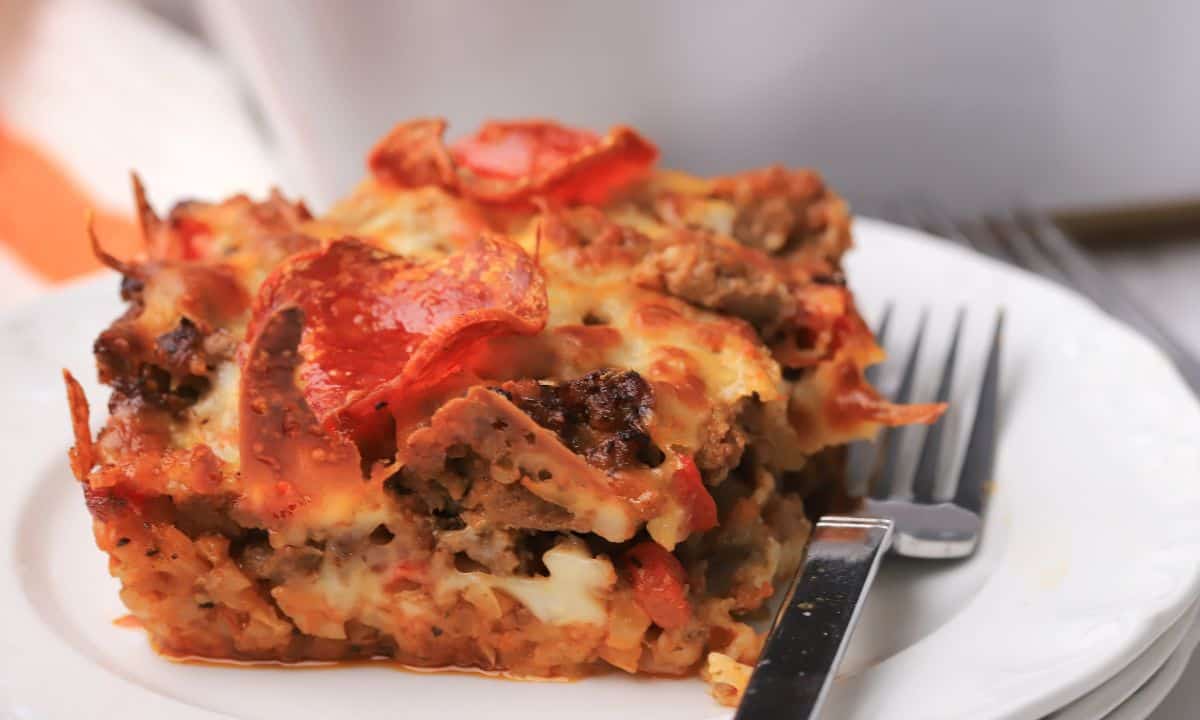 Close up of the Low carb pizza casserole slice on a plate.