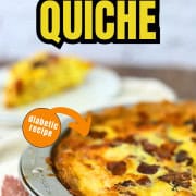 Keto quiche in a pie pan and a slice on a plate in the background.