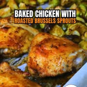 Low carb baked chicken thighs with roasted brussels sprouts on a parchment lined sheet pan.