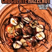 High protein chocolate hazelnut ice cream topped with roasted hazelnuts and chocolate drizzle.