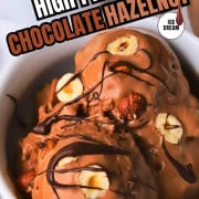 High protein chocolate hazelnut ice cream topped with roasted hazelnuts and chocolate drizzle.