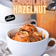 High protein chocolate hazelnut ice cream topped with roasted hazelnuts and chocolate drizzle.