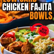 Low carb chicken fajita bowl filled with chicken, peppers, black beans, tomatoes, cauliflower rice and an avocado.