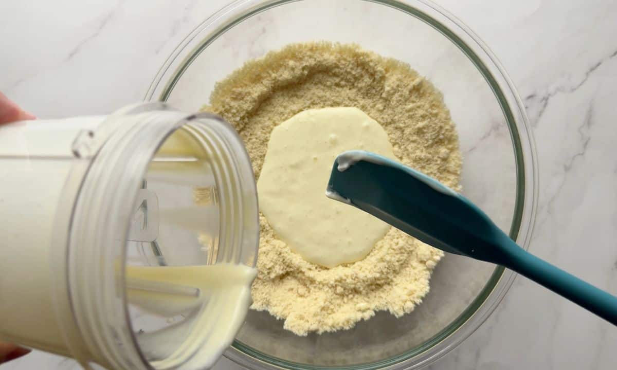 Adding the wet ingredients to the dry ingredients.
