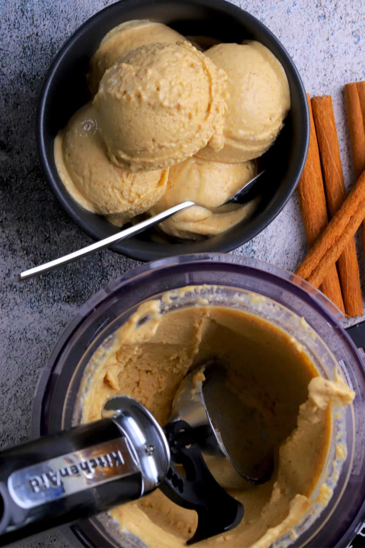 Chickpea cinnamon ice cream in a bowl next to the ninja creami pint.