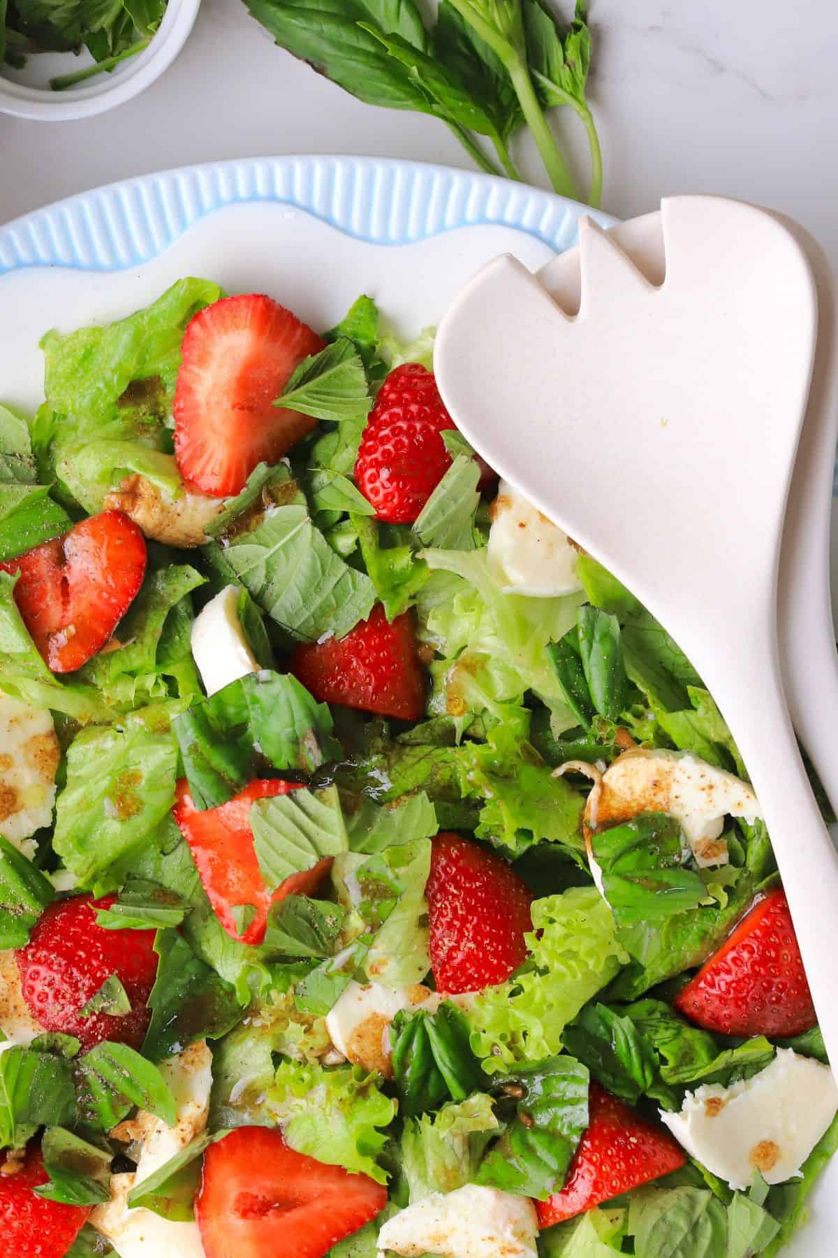 The low carb strawberry caprese salad on a plate.