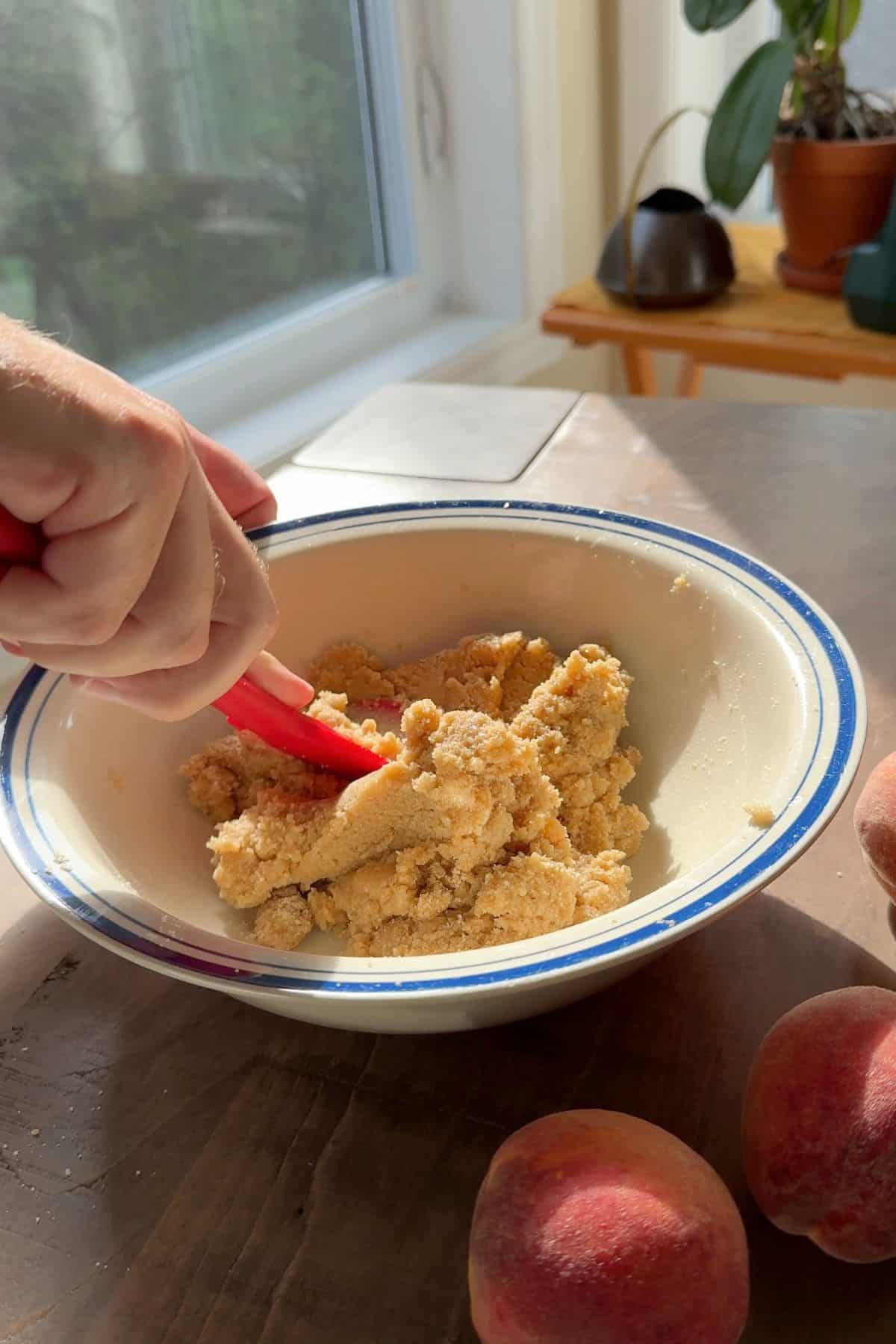 Mixing the cookie dough in a large bowl.