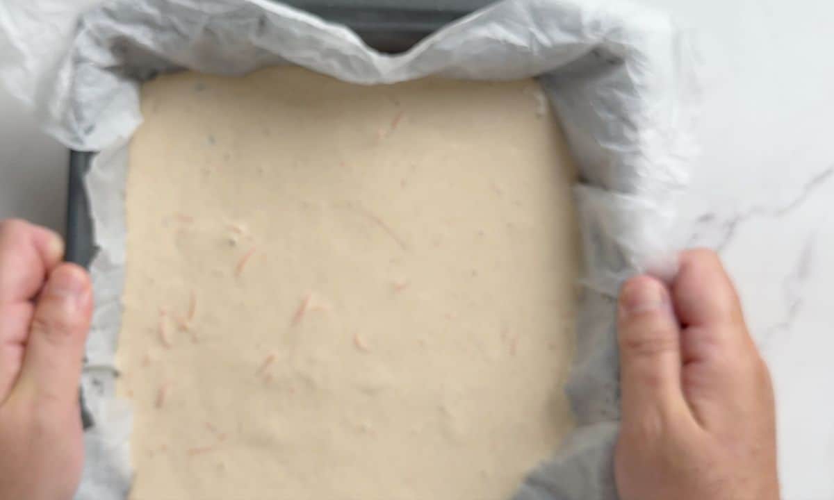 Batter in a parchment lined baking pan.
