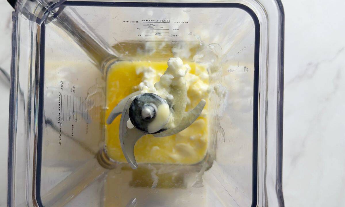 Top down shot of ingredients in a blender.