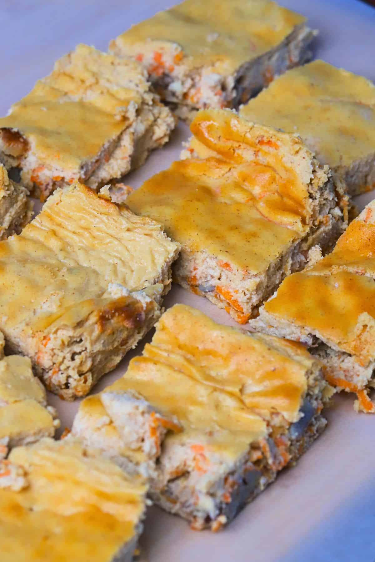 Cottage cheese carrot cake bars on a plate.
