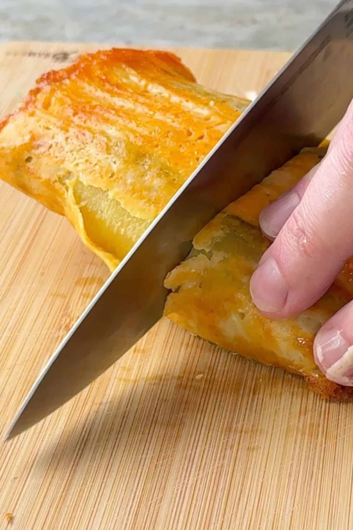 Cutting the wrap in half.