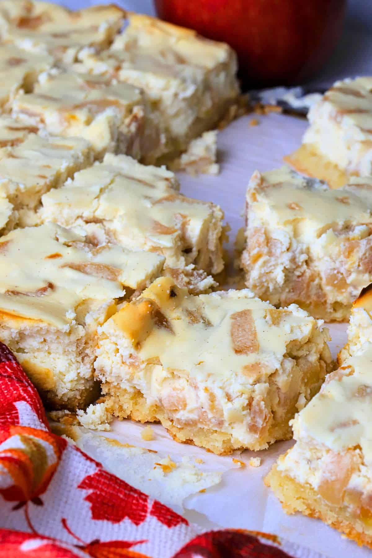 Low carb apple cheesecake bars cut into squares.