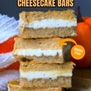 Low carb pumpkin spice cheesecake bars stacked on top of each other.